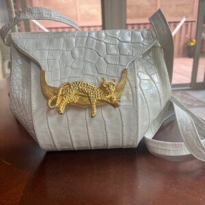 Animal patterned leather purse with Gold animal magnetic closure.